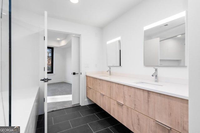 full bathroom with recessed lighting, double vanity, a sink, and tile patterned floors