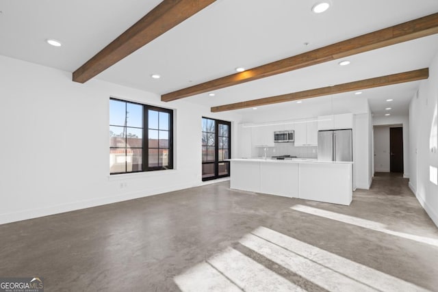 unfurnished living room featuring finished concrete floors, baseboards, beam ceiling, and recessed lighting