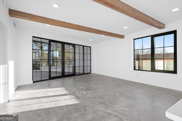 unfurnished living room featuring beam ceiling, baseboards, concrete flooring, and recessed lighting