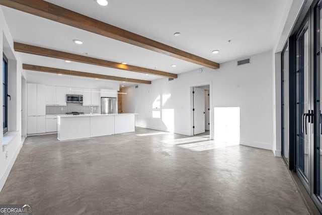 unfurnished living room featuring baseboards, concrete floors, visible vents, and beamed ceiling