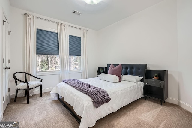 bedroom featuring carpet floors, baseboards, and visible vents