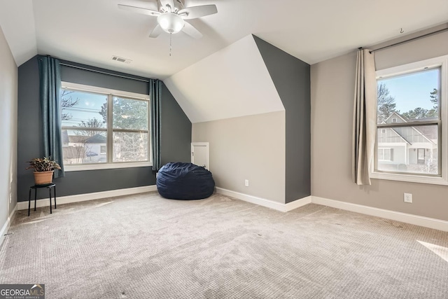 bonus room featuring vaulted ceiling, carpet floors, visible vents, and baseboards