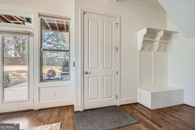 mudroom with dark wood-type flooring and baseboards