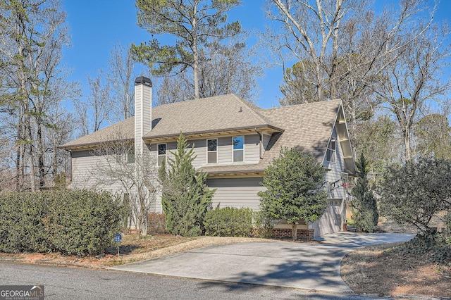 view of property exterior featuring a garage, driveway, roof with shingles, and a chimney