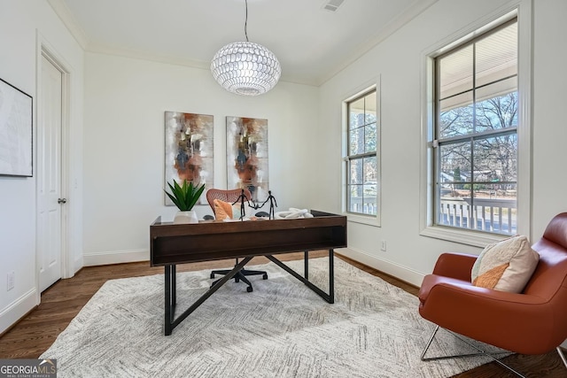 office featuring dark wood-type flooring, a notable chandelier, crown molding, and baseboards