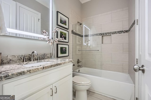 full bathroom featuring tub / shower combination, vanity, toilet, and tile patterned floors