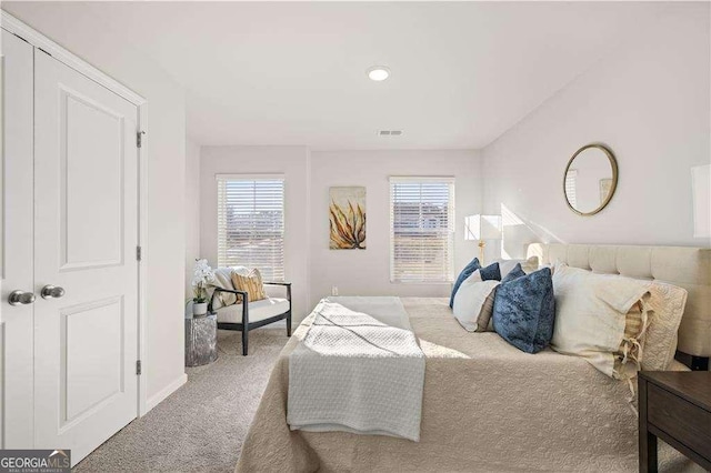 carpeted bedroom with visible vents