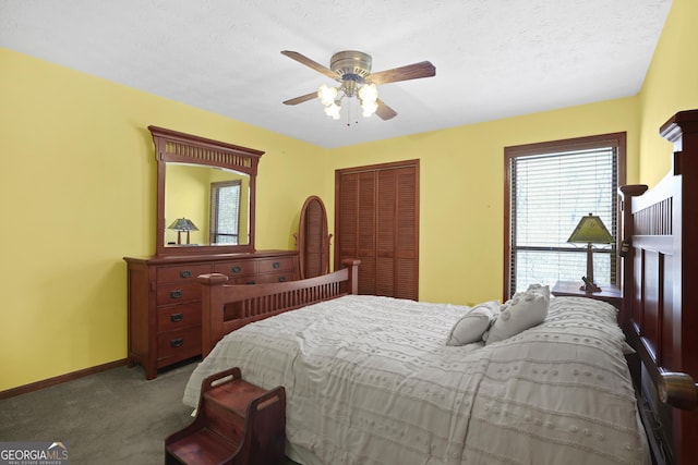 carpeted bedroom with a ceiling fan, baseboards, a closet, and a textured ceiling