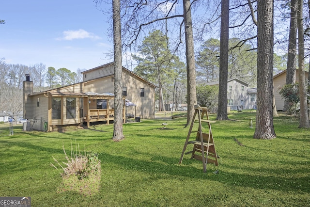 view of yard featuring a wooden deck