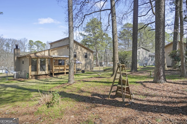 view of yard featuring a wooden deck