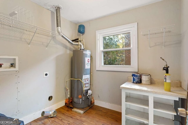 utility room featuring gas water heater