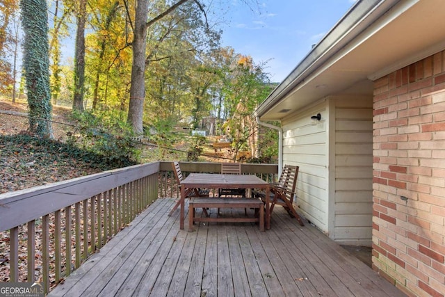 deck featuring outdoor dining area