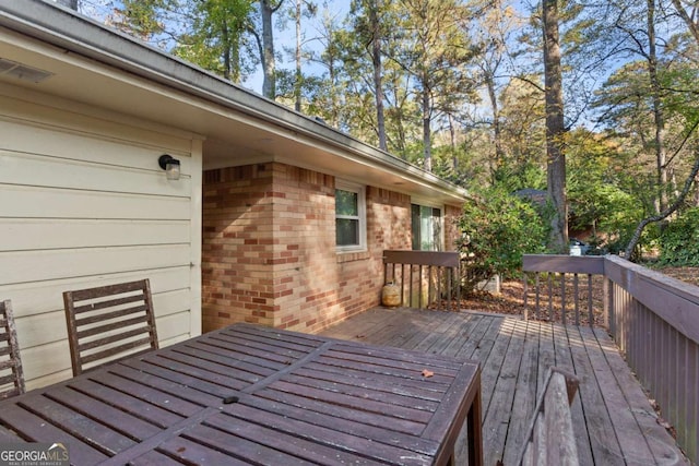 wooden deck with an attached garage