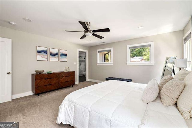 bedroom featuring a ceiling fan, carpet, and baseboards