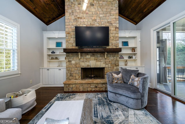 5230 Harris Springs Dr, Cumming, GA 30040 - living area with vaulted ceiling, wooden ceiling, dark wood-style flooring, a stone fireplace, and built in shelves