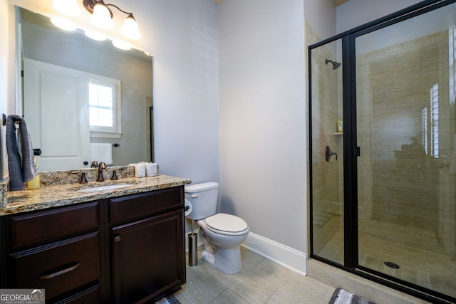 5230 Harris Springs Dr, Cumming, GA 30040 - full bath with toilet, vanity, a shower stall, baseboards, and tile patterned flooring