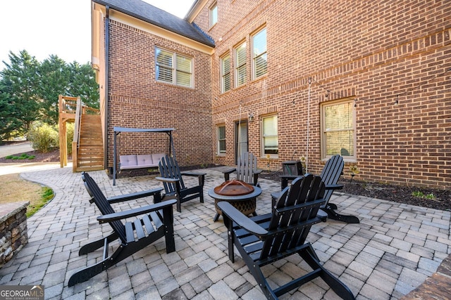 5230 Harris Springs Dr, Cumming, GA 30040 - view of patio / terrace with an outdoor fire pit and stairway