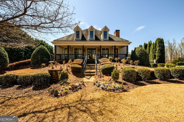 5230 Harris Springs Dr, Cumming, GA 30040 - view of front of house with a chimney, covered porch, and french doors