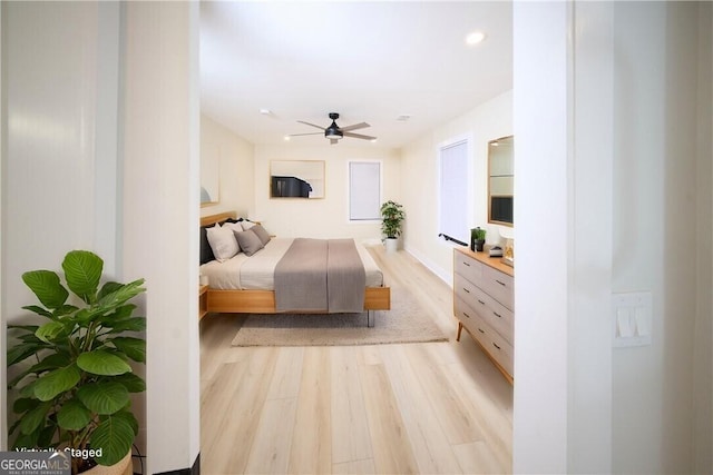 bedroom featuring light wood finished floors, recessed lighting, and a ceiling fan