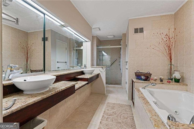 2590 Runic Way, Johns Creek, GA 30022 - full bath featuring ornamental molding, tile walls, a shower stall, a jetted tub, and tile patterned floors