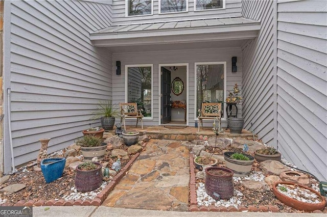 2590 Runic Way, Johns Creek, GA 30022 - entrance to property featuring a standing seam roof, a porch, and a metal roof