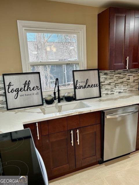 kitchen featuring tasteful backsplash, dishwasher, light stone counters, black electric range, and a sink