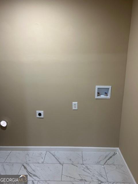 clothes washing area featuring marble finish floor, baseboards, hookup for an electric dryer, hookup for a washing machine, and laundry area