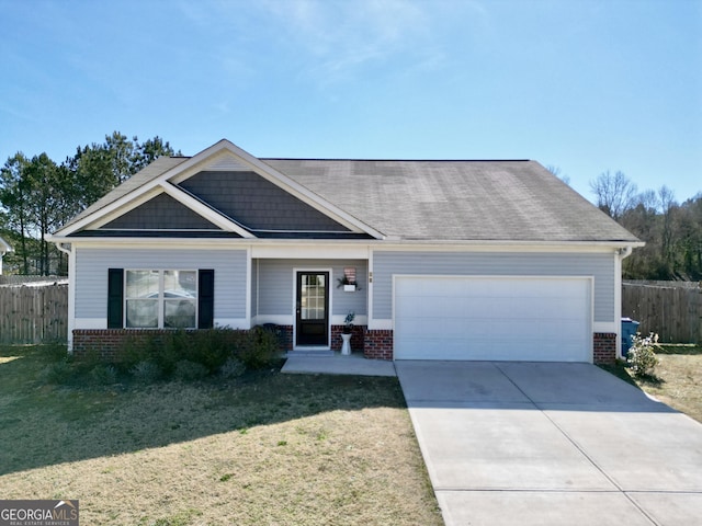 craftsman-style home featuring a garage, concrete driveway, brick siding, and fence