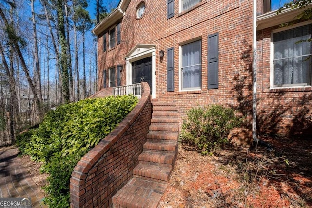 entrance to property with brick siding