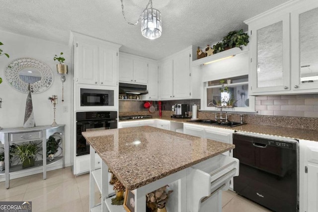 kitchen featuring open shelves, tasteful backsplash, white cabinets, a sink, and black appliances