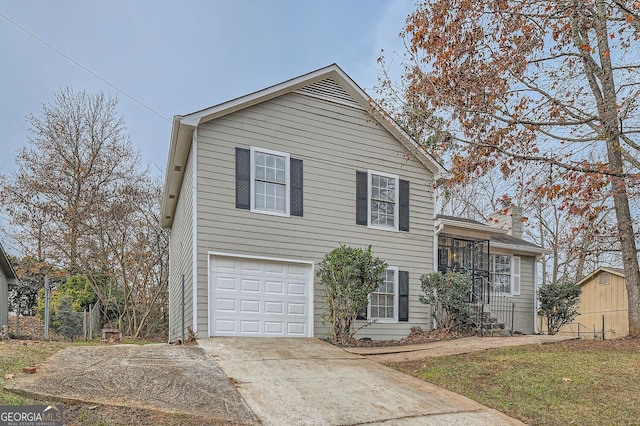 split level home with a garage and concrete driveway