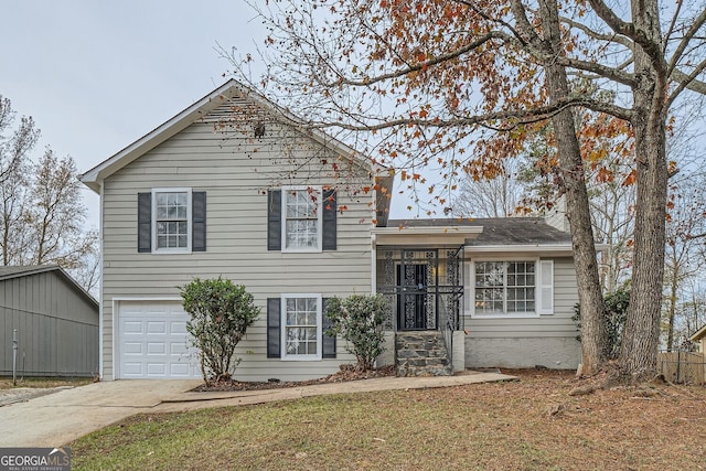 tri-level home with driveway and an attached garage