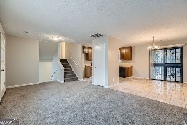 unfurnished living room with light tile patterned floors, visible vents, light colored carpet, stairs, and a chandelier