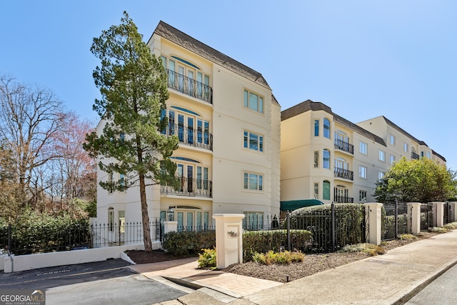 view of property featuring a fenced front yard