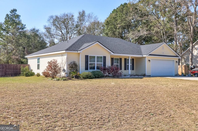 ranch-style home with concrete driveway, an attached garage, fence, and a front yard