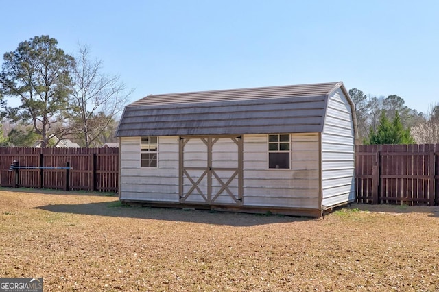 view of shed featuring a fenced backyard