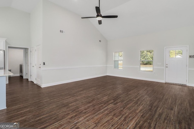 unfurnished living room with a ceiling fan, visible vents, dark wood finished floors, and baseboards