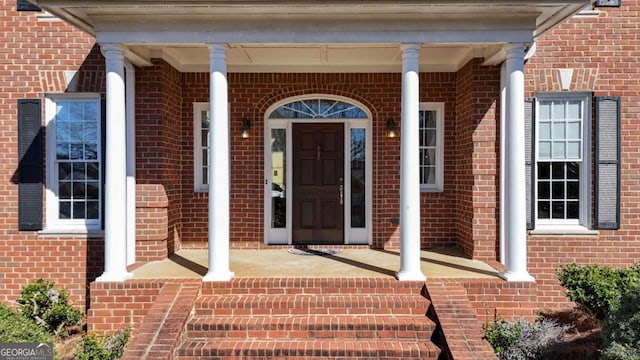 property entrance featuring covered porch