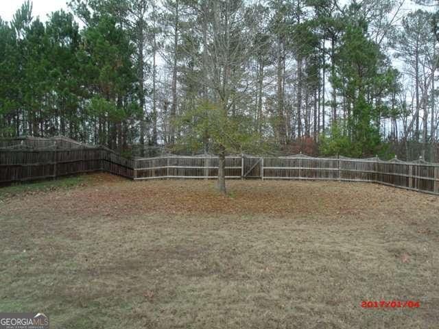 view of property's community featuring a fenced backyard