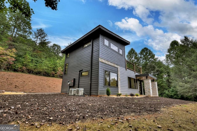 view of side of property featuring central AC unit