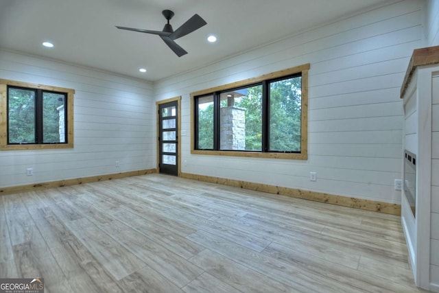 empty room featuring ceiling fan, wood finished floors, and recessed lighting