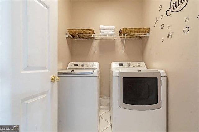 washroom featuring laundry area and separate washer and dryer