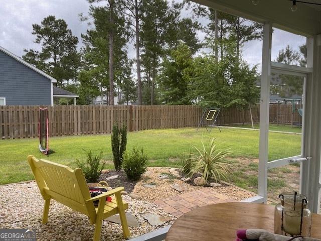 view of yard featuring a fenced backyard