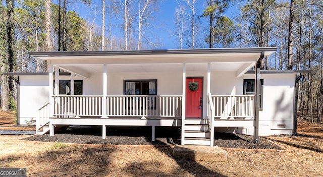 view of front of house with crawl space and covered porch