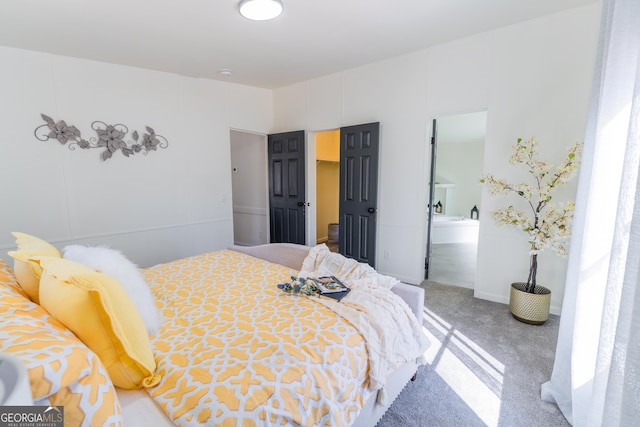 carpeted bedroom featuring ensuite bathroom