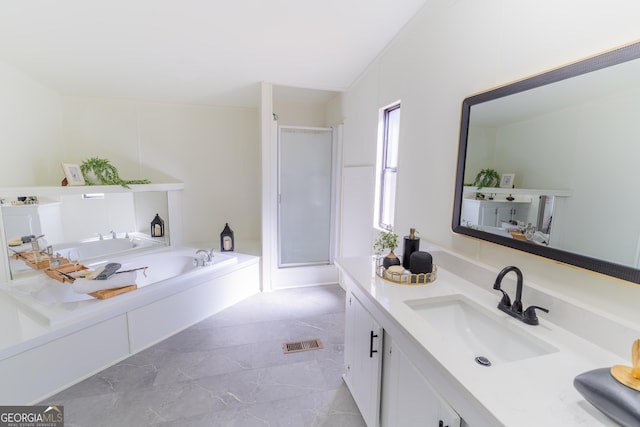 bathroom featuring a garden tub, vanity, visible vents, and a stall shower