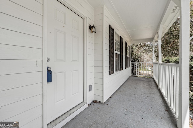 property entrance featuring covered porch