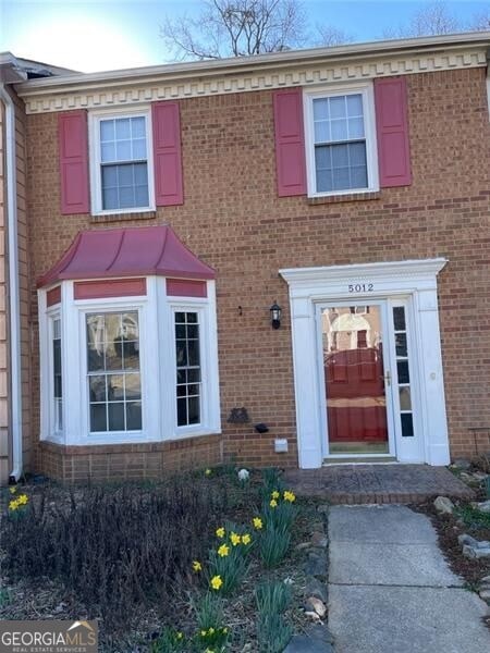 view of front of home with brick siding