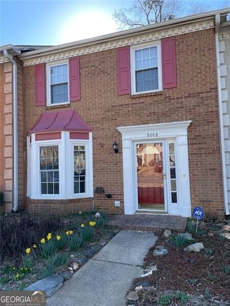 view of front of house featuring brick siding