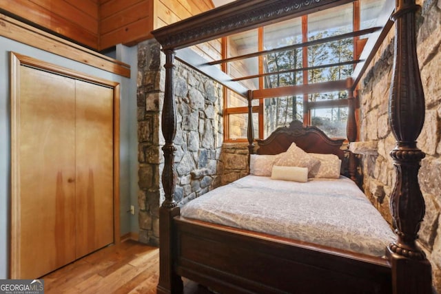 bedroom with wood finished floors